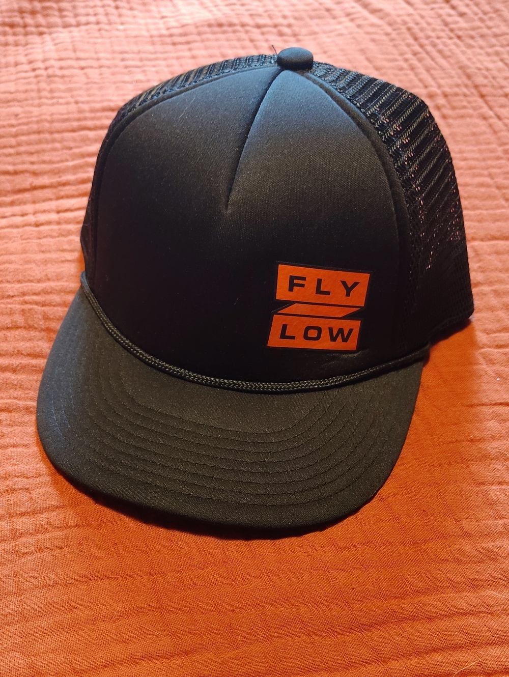Fly Low Black Trucker Hat with Orange Logo